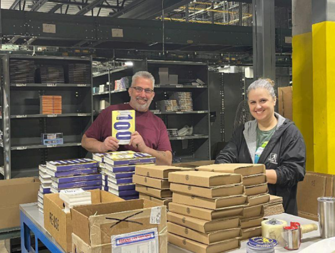 Warehouse team shipping books